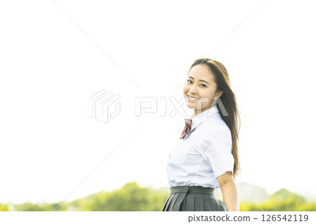 Portrait of a high school girl smiling and looking at the camera 126542119