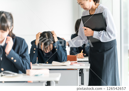 Cram school, high school girl struggling with school classes, junior high school student, high school student, elementary school student 126542657