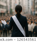 Female candidate giving a street speech 126543561