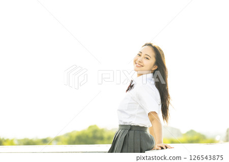 Portrait of a high school girl smiling and looking at the camera Portrait of a high school girl smiling and looking at the camera 126543875