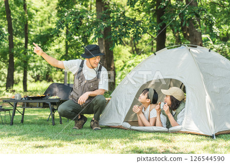 A family birdwatching at a campsite 126544590