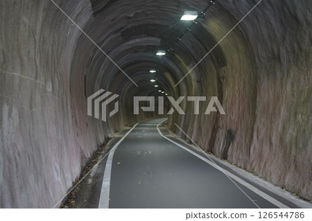 Walking through the tunnel 126544786