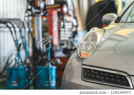 Cars in a car repair shop/pit 126544973