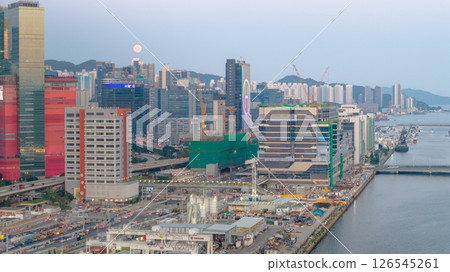 May 12 2025 Urban Cityscape with Riverfront and High-Rise Buildings at Dusk May 12 2025 Urban Cityscape with Riverfront and High-Rise Buildings at Dusk 126545261