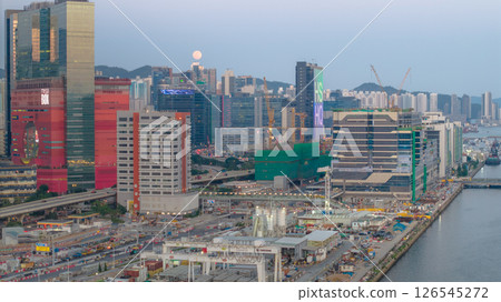 May 12 2025 Urban Cityscape with Riverfront and High-Rise Buildings at Dusk 126545272