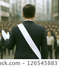 A male candidate giving a street speech during an election campaign (rear view) 126545883