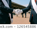 Candidates in suits shaking hands during election campaign 126545886