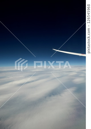 View from an airplane, above the clouds 126545968