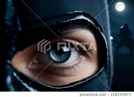 Close-up of a black-clad ninja's eyes 126545973