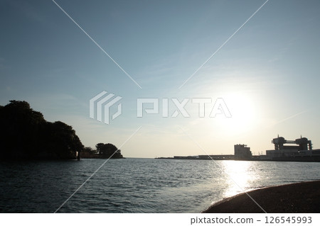 sun setting into the sea 126545993