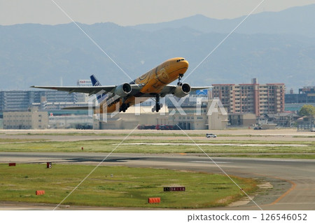 A specially painted ANA B777 taking off from Fukuoka Airport A specially painted ANA B777 taking off from Fukuoka Airport 126546052