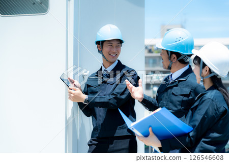 Workers working in the field Workers working in the field 126546608