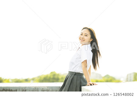 Portrait of a high school girl smiling and looking at the camera 126548002
