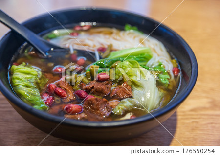 Chinese beef soup noodle with vegetable and peanut, Shanghai 126550254