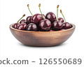 A wooden bowl filled with fresh, dark red cherries, each covered in water droplets, creating a visually appealing and appetizing image. 126550689