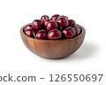 A wooden bowl filled with fresh, dark red cherries, each covered in water droplets, creating a visually appealing and appetizing image. 126550697