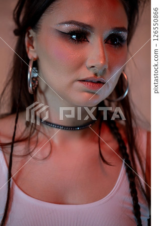 A stylish young woman showcases her unique makeup and fashionable looks, captivating all 126550866
