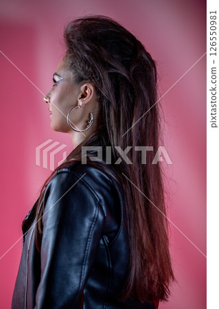 A Chic Profile Featuring a Stylish Leather Jacket Paired with a Bold and EyeCatching Hairstyle 126550981