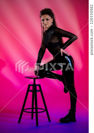 A captivating contemporary fashion pose featuring bold colors and striking textures galore A captivating contemporary fashion pose featuring bold colors and striking textures galore 126550982