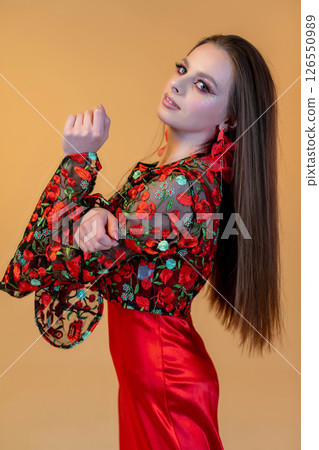 This is an Elegant Fashion Portrait featuring Vibrant Colors and Intricate Floral Patterns This is an Elegant Fashion Portrait featuring Vibrant Colors and Intricate Floral Patterns 126550989