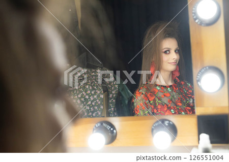 Captivating Model Reflection in Dressing Room Captures True Essence of Style and Glamour 126551004