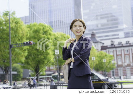A young businesswoman standing in front of Tokyo Station 126551025