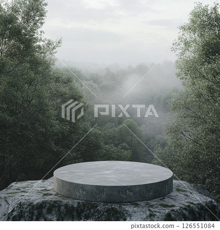 A misty forest with dense evergreen trees surrounds a large round stone platform in the foreground, creating a serene and mysterious atmosphere with soft fog rolling through the landscape. 126551084