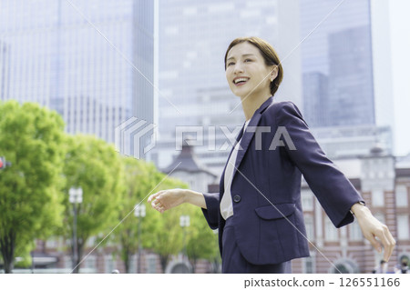 A young businesswoman standing in front of Tokyo Station 126551166