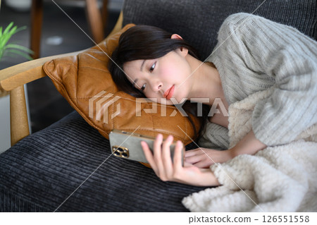 Japanese woman sleeping on the sofa Japanese woman sleeping on the sofa 126551558