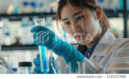 Chemistry Student Analyzing Liquid in Vitro: Science and Research in University Laboratory 126552466
