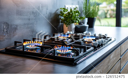 Gas stove with flames in kitchen, cooking food in house 126552475