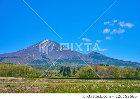 Snow still remaining on Mt. Bandai and Mt. Akahani from a viewing point along Prefectural Route 7 in Inawashiro Town, Fukushima Prefecture in spring 126552660