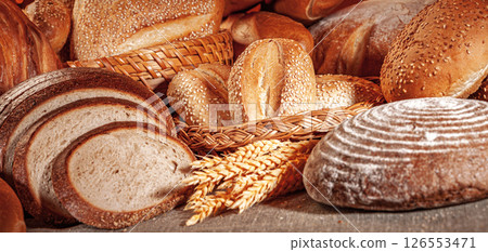Fresh baked bread. Assorted bakery products loafs of bread and rolls... Fresh baked bread. Assorted bakery products loafs of bread and rolls... 126553471