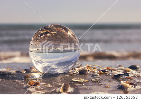 A beach landscape on a crystal ball A beach landscape on a crystal ball 126553558