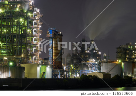 The night view of the Kawasaki factory, with its rusted exterior walls and solid structure The night view of the Kawasaki factory, with its rusted exterior walls and solid structure 126553606