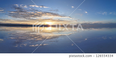 A spectacular panorama of the Uyuni Salt Flats at dusk, reflected in the sky's mirror 126554334