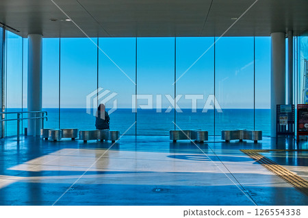 The blue sea and silence beyond the glass of JR Hitachi Station 126554338