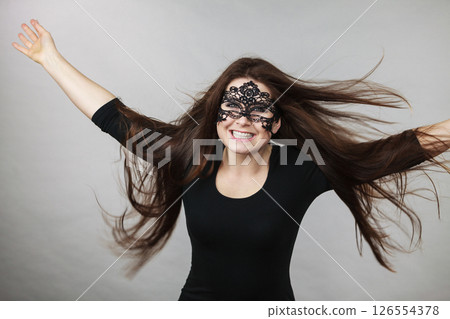Mysterious woman wearing lace mask 126554378
