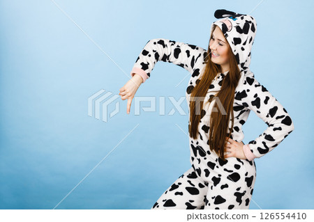 Woman wearing pajamas cartoon pointing down 126554410