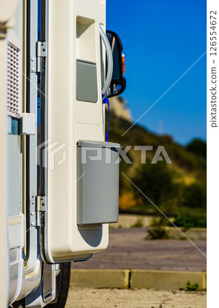 Camper door with trash can. 126554672