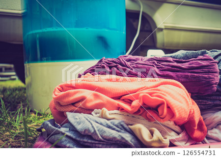 Washing laundry outdoor at caravan 126554731
