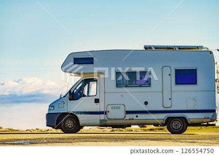 Rv caravan in mountains above clouds Rv caravan in mountains above clouds 126554750