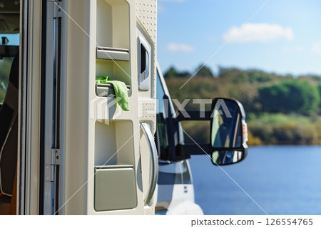 Rv caravan on lake shore Rv caravan on lake shore 126554765