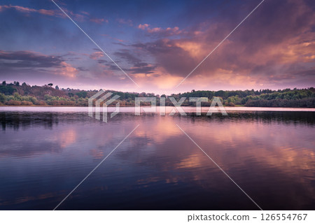 Sunset over lake water Sunset over lake water 126554767