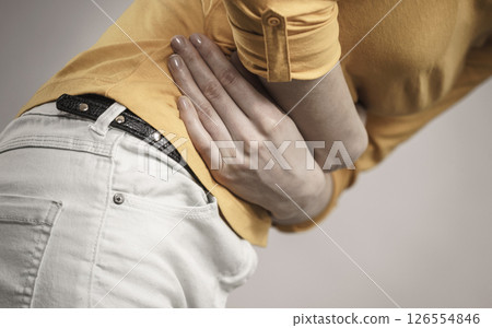 Woman suffer from belly pain. 126554846