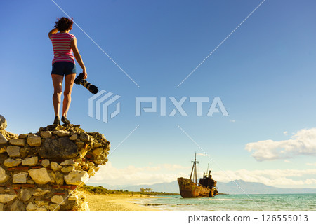 Tourist take photo on beach sea shore 126555013