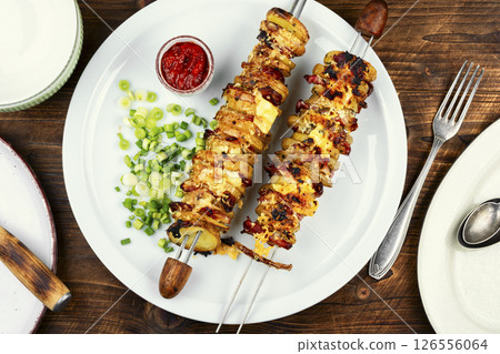 Delicious roasted potatoes with crispy bacon. Delicious roasted potatoes with crispy bacon. 126556064