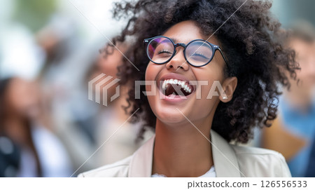 Laughing woman wearing glasses. 126556533