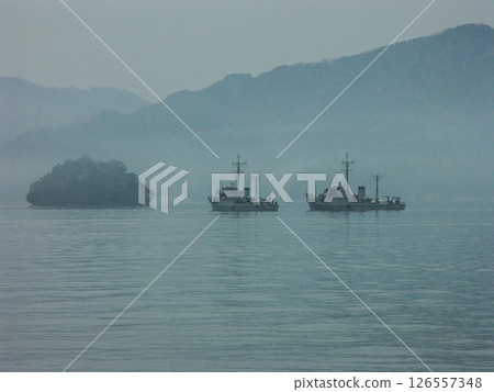 Boats training in the foggy Maizuru Port 126557348