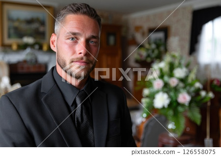 Compassionate Young Man at Funeral Home Compassionate Young Man at Funeral Home 126558075